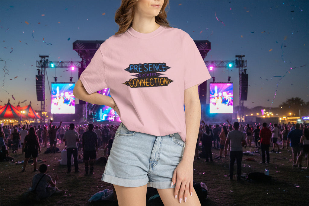 Person wearing a pink t-shirt with text design, standing against a neutral background.